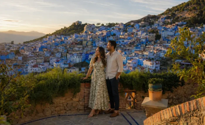 Couple enjoying panoramic view of Chefchaouen during an 8 days Morocco tour from Fes