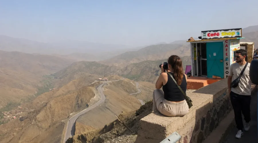 Tourist enjoying the Atlas Mountains viewpoint during the 6 days Fes to Marrakech desert tour