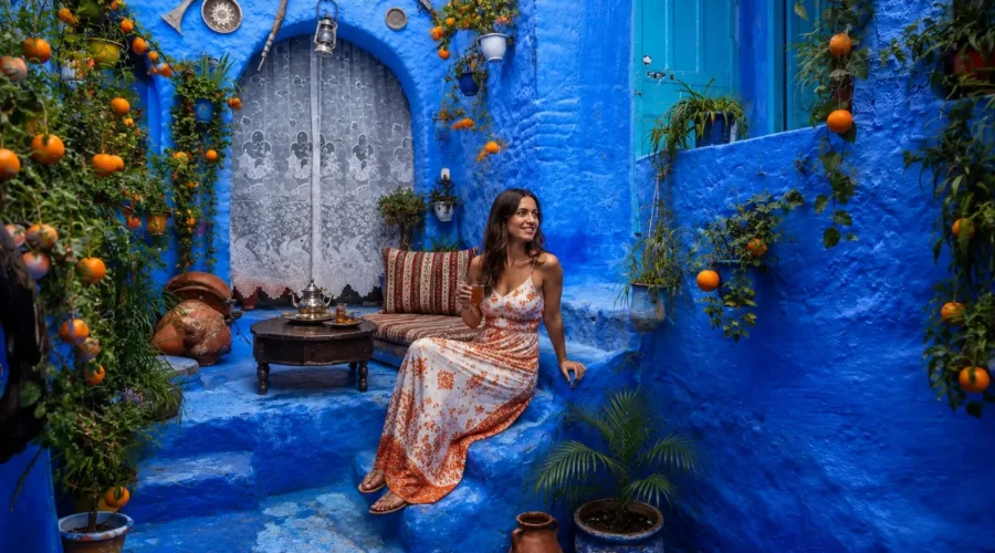 Traveler in the blue streets of Chefchaouen Morocco