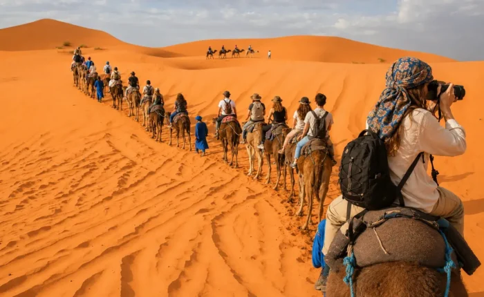 Camel caravan crossing the Sahara Desert dunes in Morocco, 14 Days Tour from Casablanca
