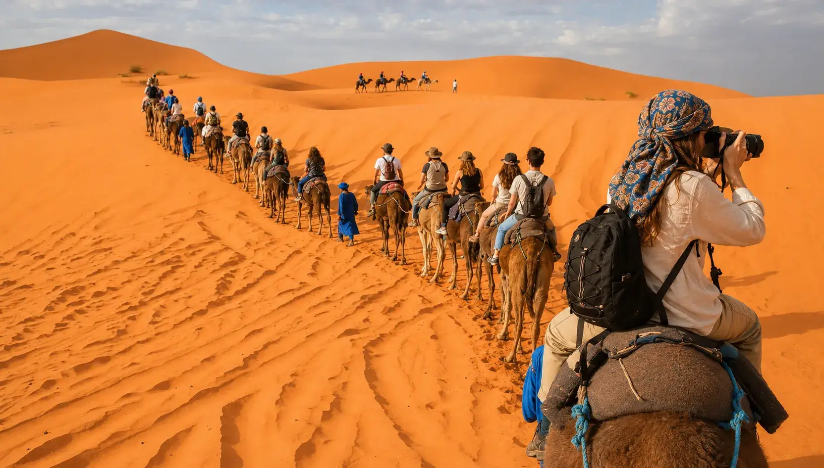 Camel caravan crossing the Sahara Desert dunes in Morocco, 14 Days Tour from Casablanca