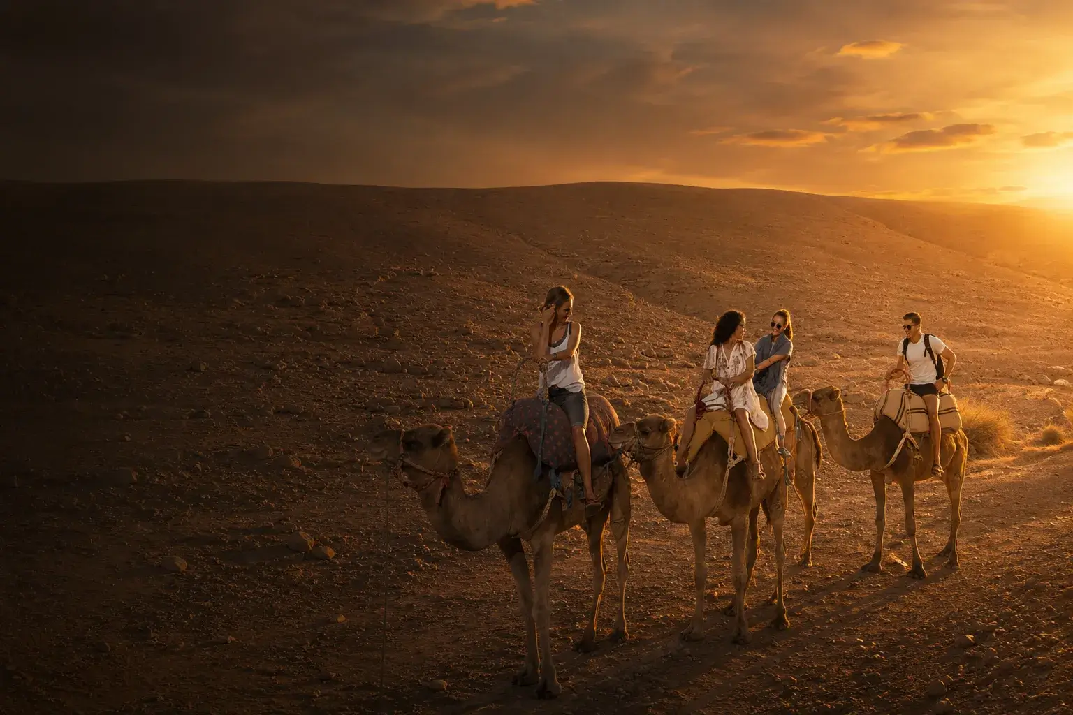 Agafay Desert Camel Ride from Marrakech Agafay Desert Camel Ride from Marrakech with travelers riding camels at sunset